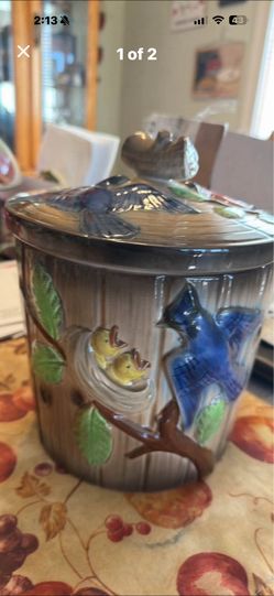 This is a vintage Norcrest bluebird log ceramic cookie jar
