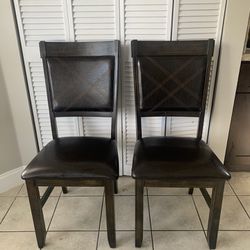 Two Leather Chairs