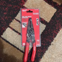 Multi purpose wire stripper with crimper