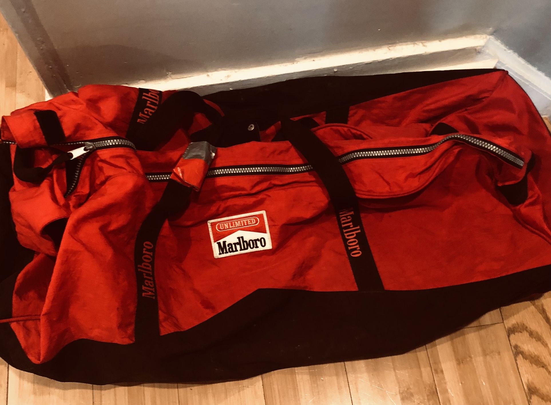 Vintage Marlboro Unlimited EXTRA LARGE Red Black Rolling Duffle Bag Wheels And Strap