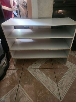 2 white stackable wood shells