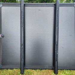 Under cover hard tonneau cover designed for the bed of a Ford F-150