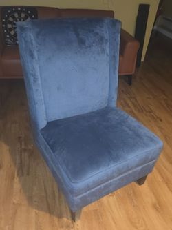 Sunpan Malibu Ink Blue Wing Chair with silver nailhead trim.