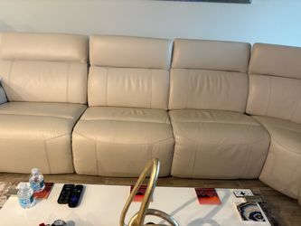 SECTIONAL SOFA HAS 3 RECLINING CHAIRS AND POWER HEAD RESTS