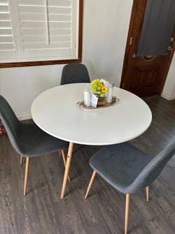 42 inch White Round dining table with 3 grey chairs