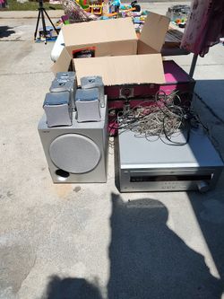 SONY SURROUND SPEAKERS AND SYSTEM WITH DVD HAS FIVE SMALL SPEAKERS AND ONE LARGE SPEAKER