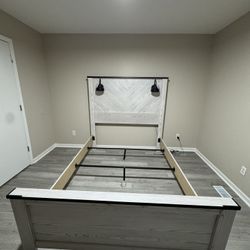 bed set with lamps overhead