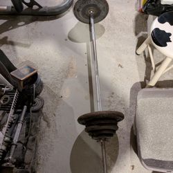 106 Pounds of Standard Weights with a 5 Foot Straight Bar