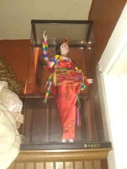 Japanese doll in a case