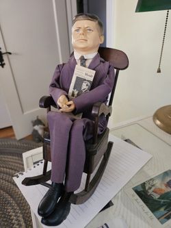 John F Kennedy In Rocking Chair Woth Newspaper