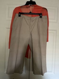 There is two pieces it Capri pants in size 12  blouse size small both for $25