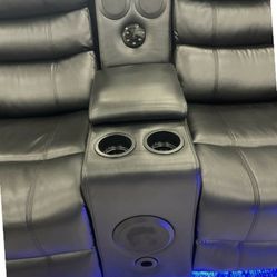 New leather reclining sectional with speakers
