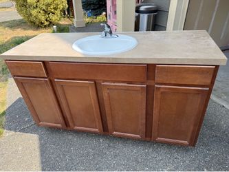 Bathroom vanity with sink and toilet