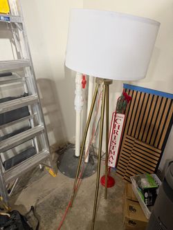 Standing lamp light. Gold and white