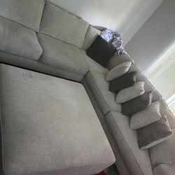 Three piece sectional with large ottoman