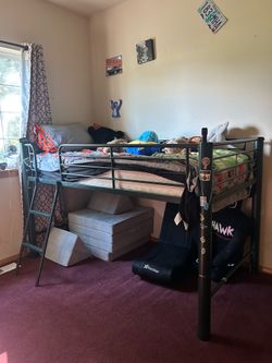 Loft bed with slide attachment