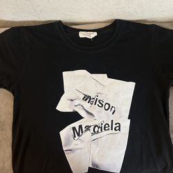 Mildly worn black medium sized Masion margiela T-shirt. 