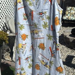 I This is a Disney Hawaiian-themed dress featuring Mickey Mouse and Minnie Mouse in a tropical setting