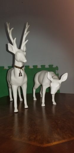 Male and female white ceramic reindeer with silver collars