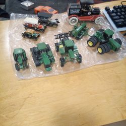 I Have All Kind Of Different Item Different Cars Piggy Bank Card At Black And Red Car Is The Piggy Bank And The Other Goods Tractors Toys