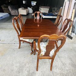 wooden dining room with 6 chairs
