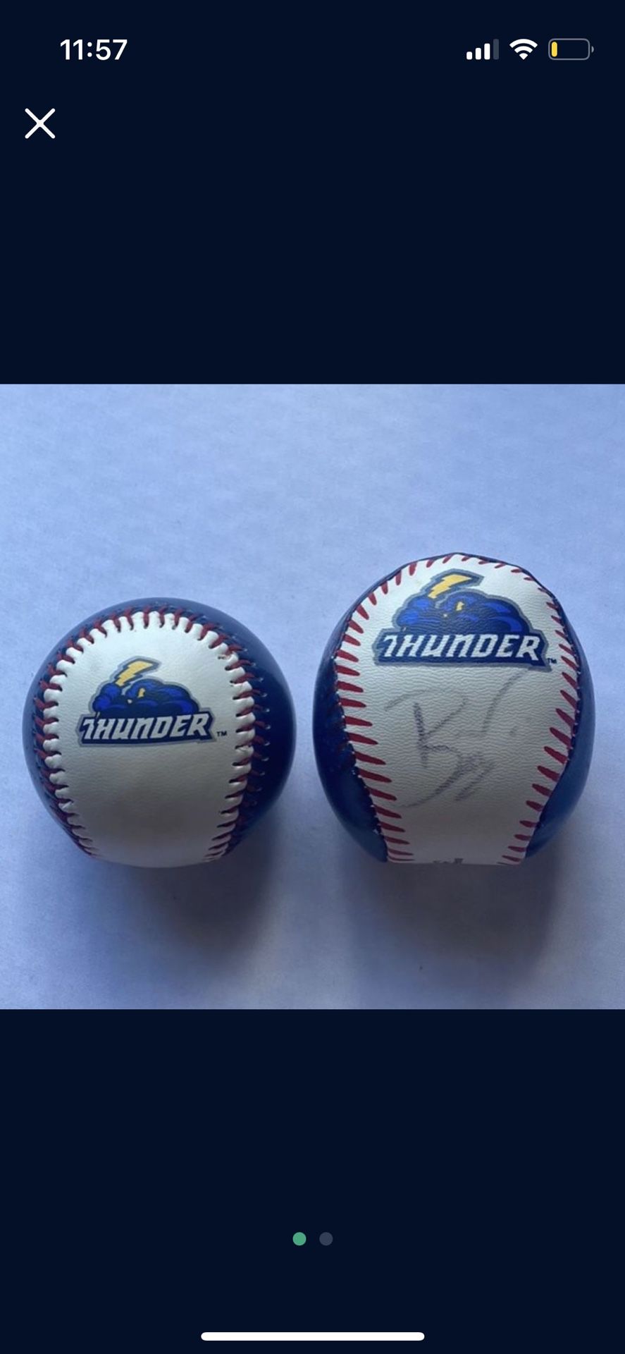 2 thunder baseballs (left one was caught during a game and right one is signed)