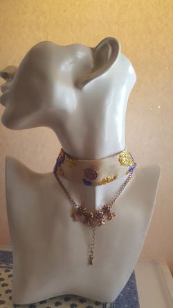 Cute pineapple choker. With gold and purple jewelry