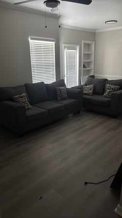 Grey couch /love seat exclusive furniture