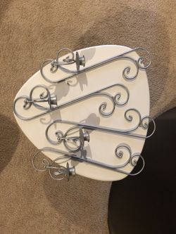 Wall mounted taper candle holders