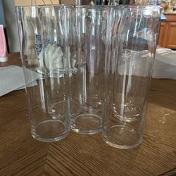 6 clear Glass Cylinder Vases And 2 Bigger vases 