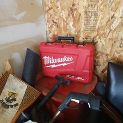 Milwaukee Tool Case Only Has Battery Charger  And A Handle Attachment.