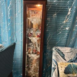 Brown buffet with glass sides and 4 rows in great condition.