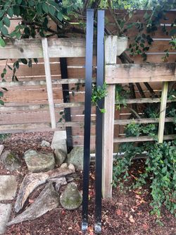 Two Black Metal Square Fence Posts