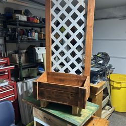 Garden planner with a trellis backdrop