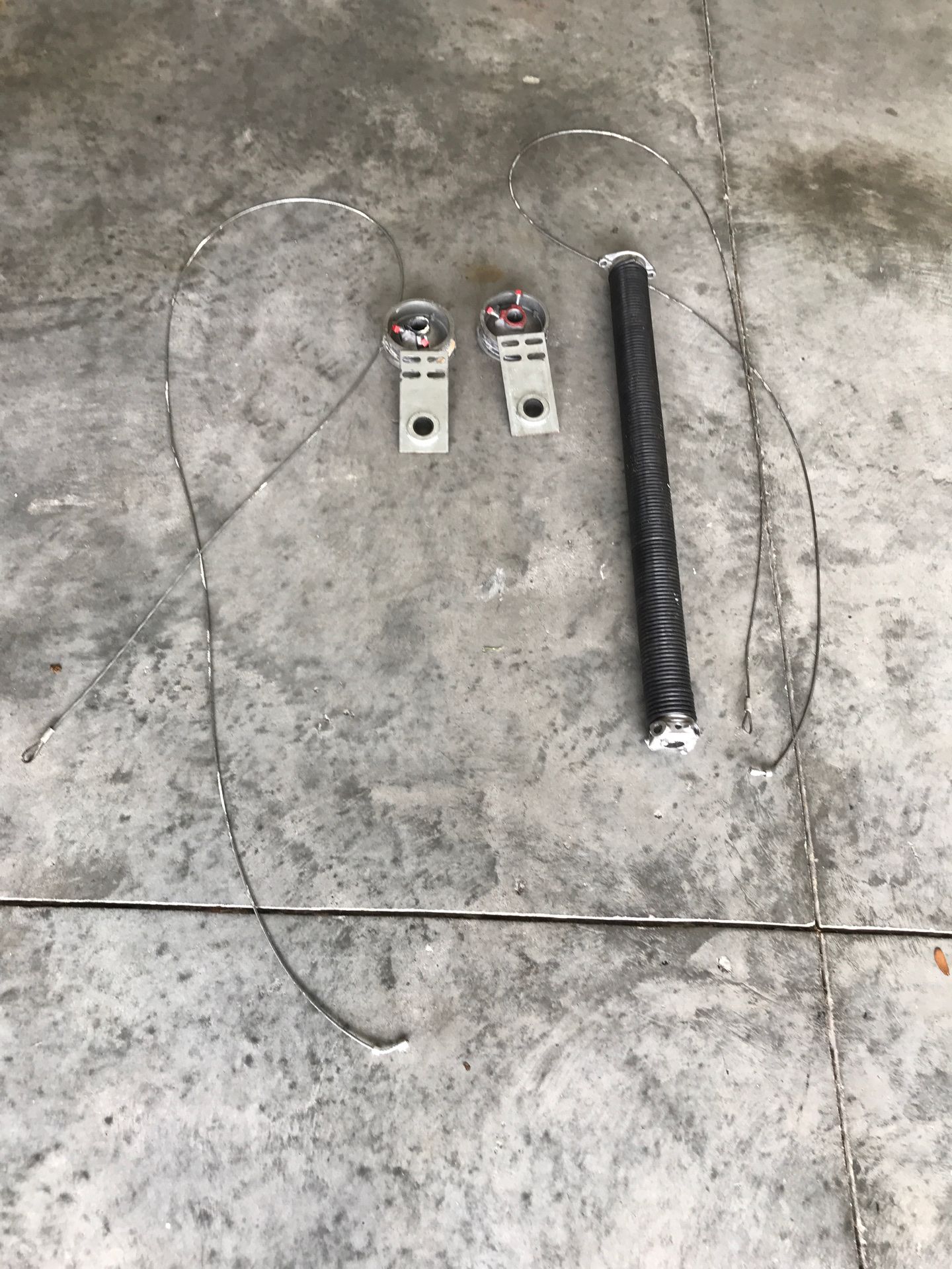 Garage door torsion spring disk and End bearing plates and wires.