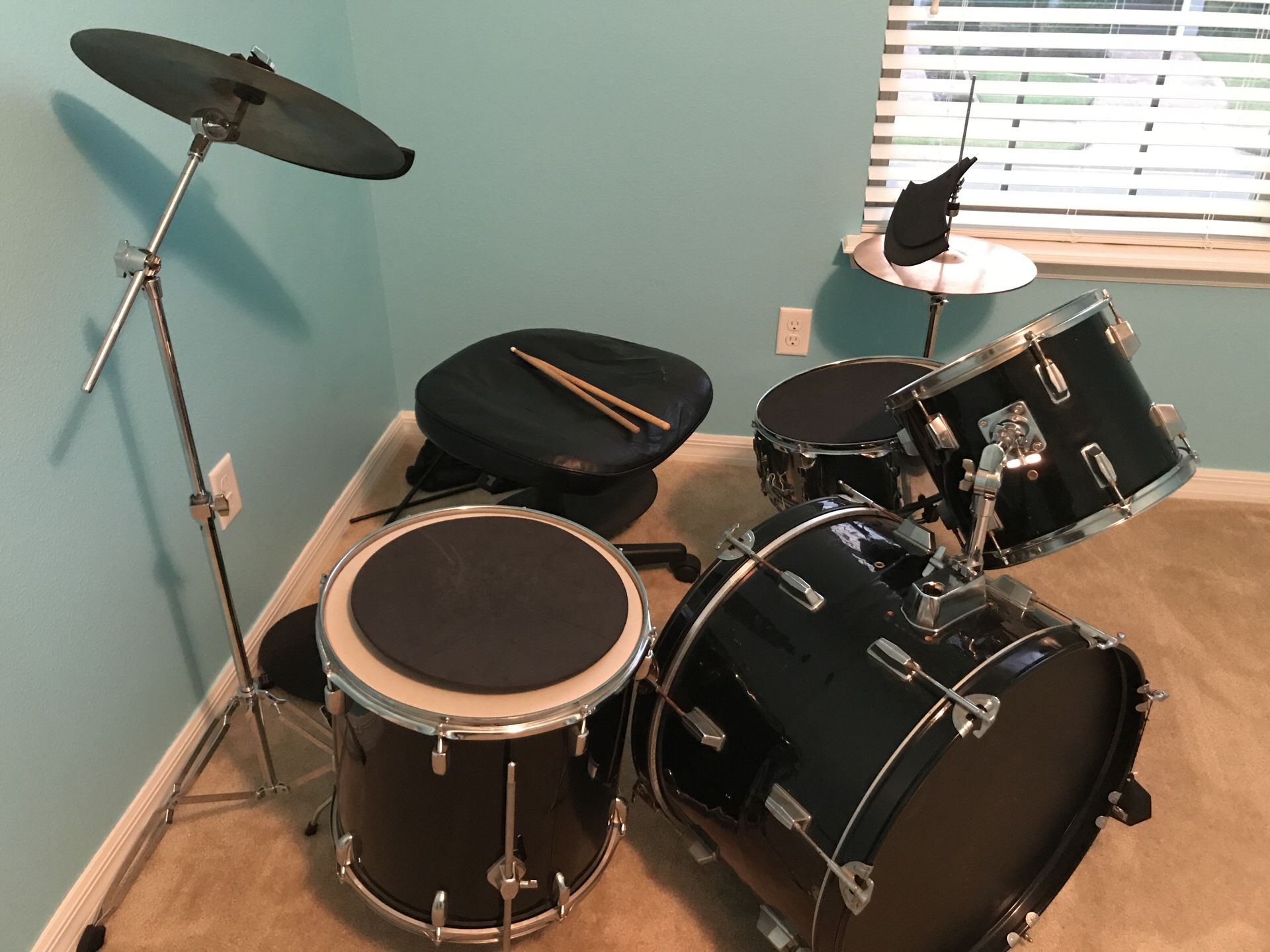 Drum set with chair, music sheet stand and silencer pads
