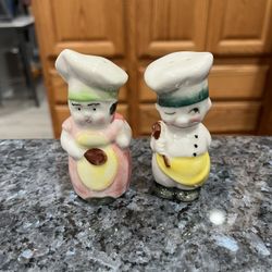 Vintage Japan Ceramic Boy and Girl Chef Salt and Pepper Shakers.  Size approximately  3 1/2 inches Tall. Preowned no stoppers.  Has been on display in