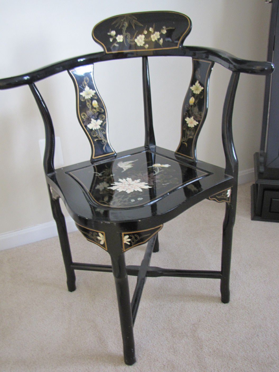 Black lacquer corner chair.