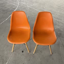 2 Orange Plastic Chairs