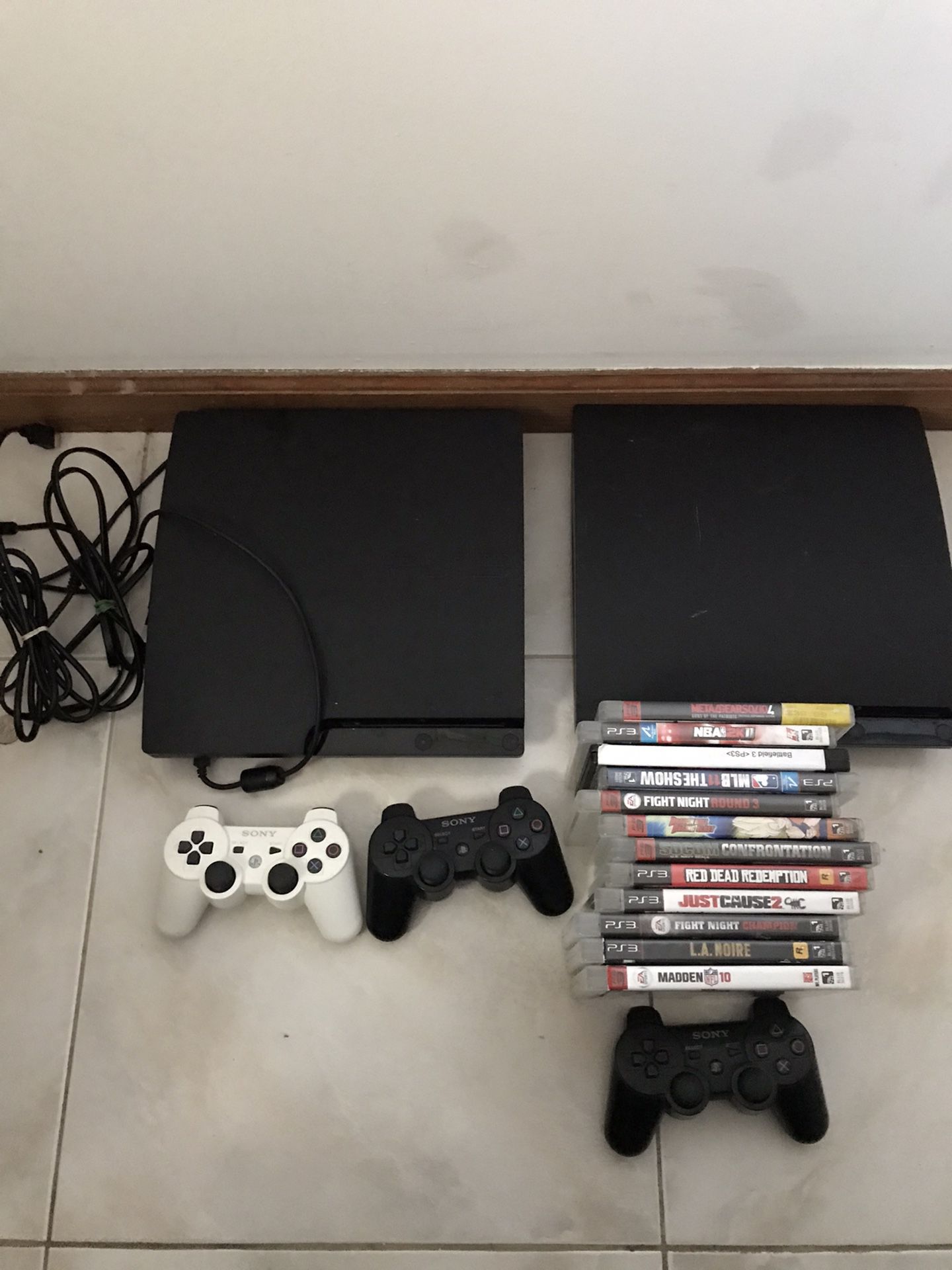 Two ps3 plus controls and games and Xbox 360 and controls