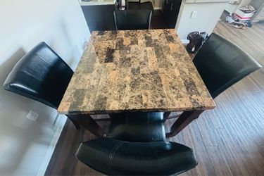 Dinette set with table and 4 leather chairs