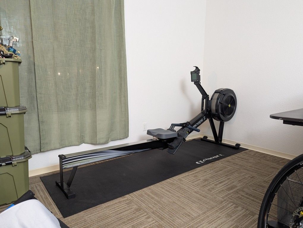 Concept2 Row Erg with PM5 monitor (with floor mat, phone holder, and optional wall hanger)