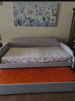 Twin bed with undercarriage
