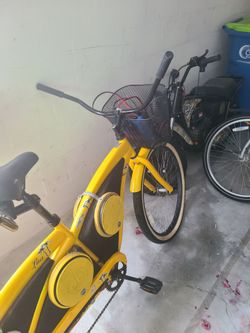 yellow two-seater beach cruiser with custom music