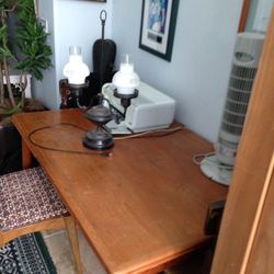 set of 4 chairs and teak dining room table expands to twice it's size