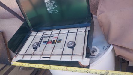 COLEMAN CAMPING STOVE IS NEW ONLY GRILL USED ONCE