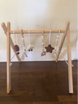 Natural wood baby play gym with cute mat