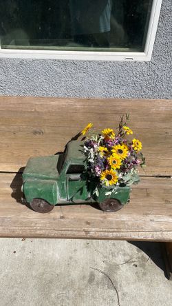 Really cool yard art metal vintage truck.