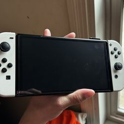 Nintendo Switch OLED for Sale Only Used Twice. Basically New, Comes With Games As Well As Charger And Tv Dock For The Console. As Well As Evee Joy Con