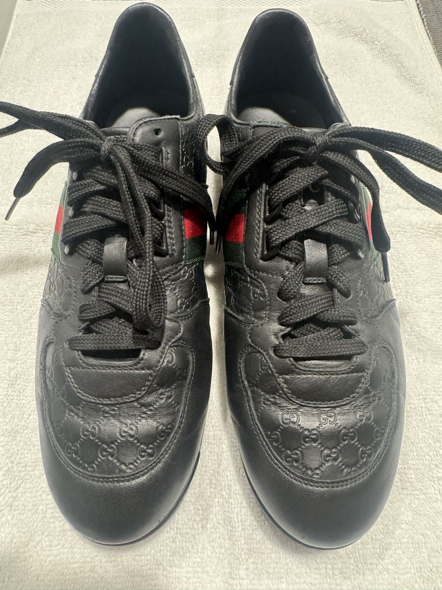 Gucci Men’s Guccissima black leather Web stripe sneakers